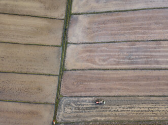 Aerial view of tractor on agricultural field at Bali - CAVF60971