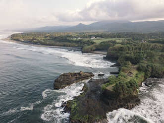 Scenic view of sea by landscape against cloudy sky - CAVF60975