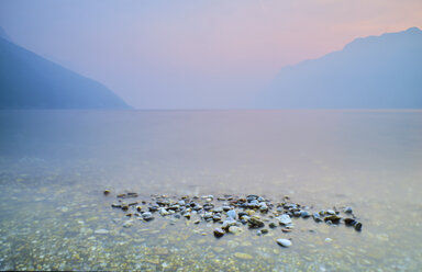 Italy, Torbole, Lake Garda, pebbles at lakeshore - MRF01939