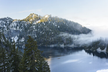 High angle view of calm lake amidst mountains against sky during winter - CAVF61779