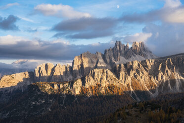 Scenic view of Dolomites against cloudy sky during sunset in forest - CAVF61797