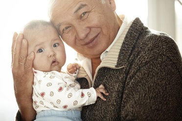 Portrait of happy grandfather head to head with his granddaughter - AZF00135