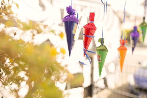 Miniature school cones hanging in a row - MFRF01226