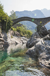 Switzerland, Ticino, Verzasca Valley, Verzasca river and historical Ponte dei Salti bridge - GWF05961