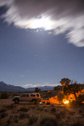 Campfire on field against sky at night - CAVF62530