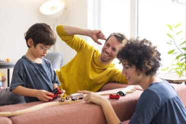 Happy family playing with their kids on a weekend - JOSF03093