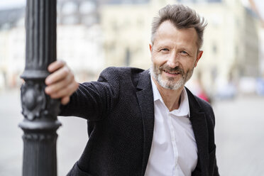 Portrait of smiling mature businessman with greying beard - DIGF06011