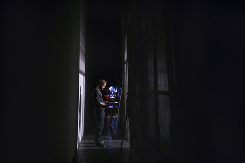 Actor with script rehearsing on stage of theatre - FBAF00303