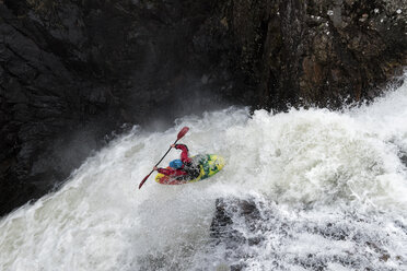 Man kayaking on waterfall on river - ALRF01433