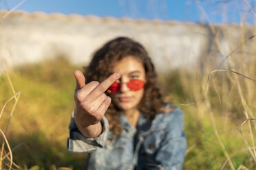 Young woman giving the finger, close-up - AFVF02579