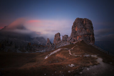 Low angle view of Cinque Torri against sky during sunset - CAVF62879