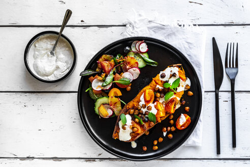 Beked sweet potato with vegetables and Tahini sauce served with mixed salad - SARF04138