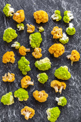 Yellow and bright green cauliflower florets on slate - SARF04143