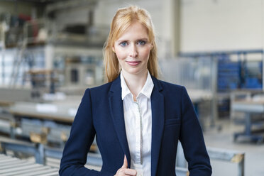 Portrait of confident businesswoman in factory - DIGF06154