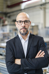 Portrait of confident businessman in factory - DIGF06160