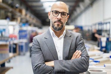 Portrait of confident businessman in factory - DIGF06179