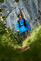 Hiker trekking in Annecy, Rhone-Alpes, France - CUF49554