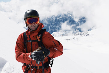 Male skier on mountainside, portrait, Alpe-d'Huez, Rhone-Alpes, France - CUF49669