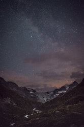 Idyllic view of mountain ranges against star field at night - CAVF63043