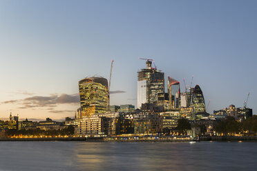 UK, London, City of London, River Thames, skyline with modern office buildings at sunset - MKFF00450