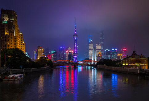 Pudong skyline and Waibaidu Bridge over Huangpu river at night, Shanghai, China - CUF49831