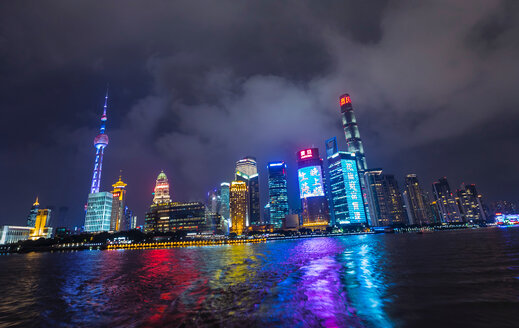 Pudong skyline with Oriental Pearl Tower at night, view from star ferry, Shanghai, China - CUF49837