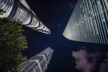Jin Mao Tower, Shanghai Tower, Shanghai World Financial Centre at night, low angle view, Shanghai, China - CUF49851