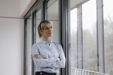 Successful businesswoman in conference room, with arms crossed - JOSF03152