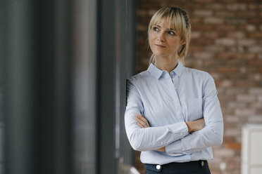 Portrait of a blond businesswoman with arms crossed - JOSF03223