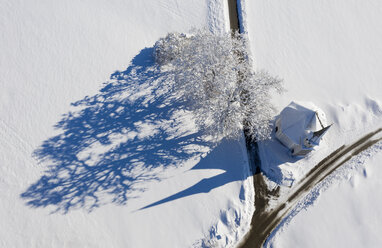 Germany, Upper Bavaria, Harmating, St. Leonhard's chapel in winter, drone view - LHF00610