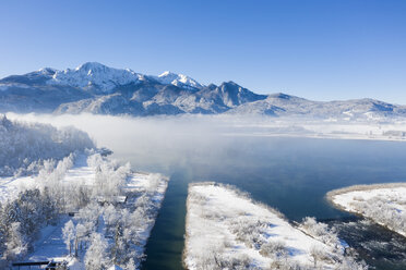 Germany, Upper Bavaria, Kochel, Aerial view of Lake Kochel in winter, in the backgrund Herzogstand and Heimgarten - LHF00618