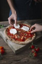 Two friends preparing a pizza with mozzarella - ALBF00809