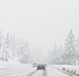 Cars driving on snow covered road - MINF10600