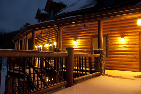 Illuminated cabin at night - MINF10916