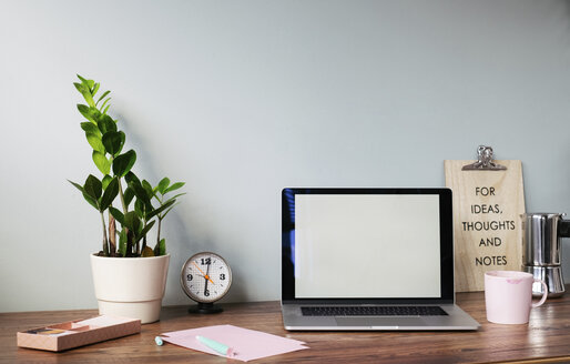 Desk with laptop at home office - MOMF00634