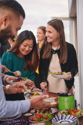 Friends enjoying buffet on terrace - MASF11578