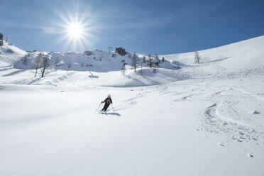 Germany, Bavaria, Berchtesgaden, Backcountry skiing against the sun - HAMF00572