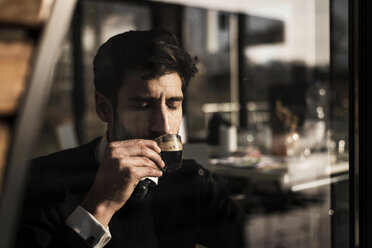 Businessman enjoying his coffee - MJRF00125