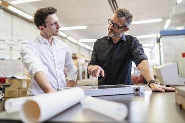 Two colleagues in factory working on solar cell - DIGF06236