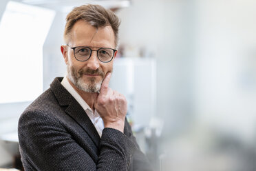 Portrait of confident businessman in office - DIGF06397