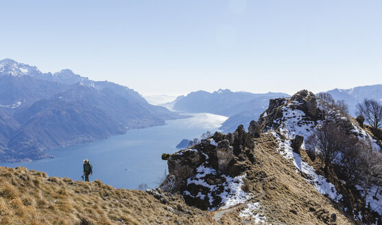 Italy, Como, Lecco, woman on a hiking trip in the mountains above Lake Como - MRAF00378