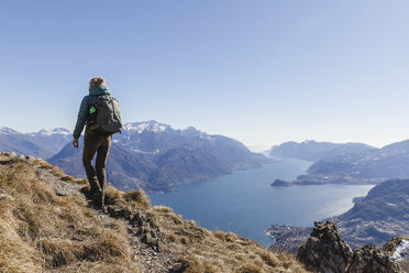 Italy, Como, woman on a hiking trip in the mountains above Lake Como - MRAF00386