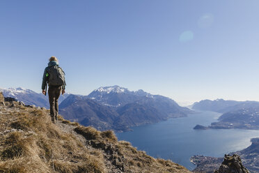 Italy, Como, woman on a hiking trip in the mountains above Lake Como - MRAF00387
