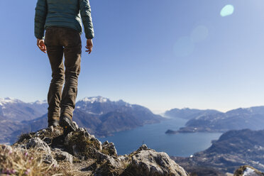 Italy, Como, Lecco, woman on a hiking trip in the mountains above Lake Como - MRAF00395