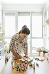 Woman painting at home - MGOF03977