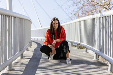 Young contemporary dancer on a footbridge, resting - JRFF02859