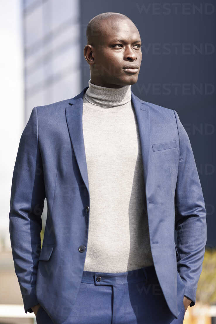 https://us.images.westend61.de/0001165054pw/portrait-of-businessman-wearing-blue-suit-and-grey-turtleneck-pullover-JSMF00874.jpg