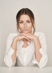 Portrait of smiling young woman wearing white blouse - PNEF01357