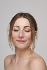 Portrait of beautiful young woman with freckles and closed eyes - PNEF01363
