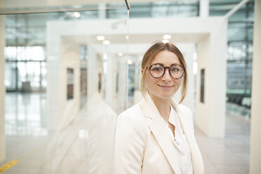 Portrait of confident young businesswoman wearing glasses - PNEF01373